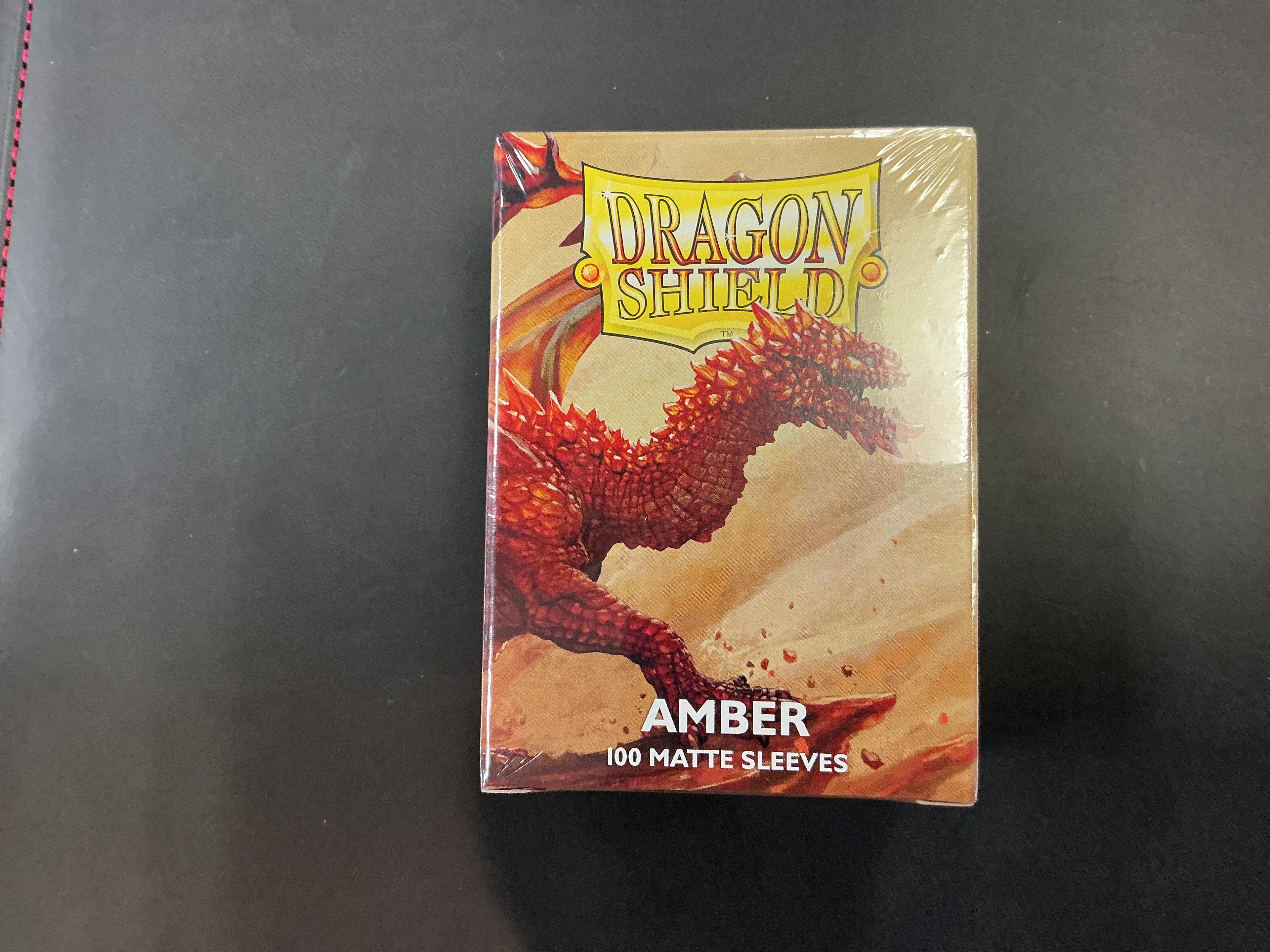 Sleeves: dragon shield, Amber, 100 matte sleeves ￼